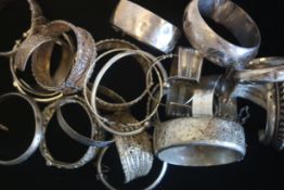 a selection of silver marked bangles, engraved and detailed patterns, makred and tested as silver,