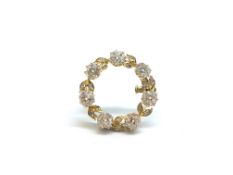 Old Cut Diamond Circular Brooch. The seven old cut diamonds each weighing approximately 0.35cts