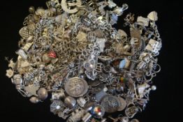 a selection of various silver charms and bracelets marked and tested as silver, approx gross