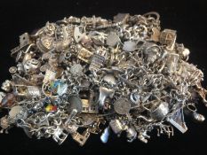 a selection of various silver charms and bracelets, marked and tested silver, approx gross weight