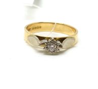 A solitaire diamond ring. Approximately 4.1g gross, ring size O. Fully hallmarked for 18ct gold.