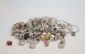 A selection of fashioned desighned charms and bracelets, mostly stone set, marked and tested as