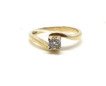 A solitaire diamond ring. Approximately 2.1g gross, ring size K 1/2. Fully hallmarked for 9ct