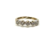 Diamond half eternity ring, ten stones set in yellow and white metal, stamped and tested as 9ct,