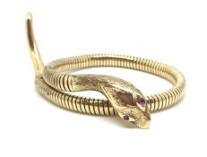 Vintage snake bangle, coiled bangle with engraved head, gem set eyes, hallmarked 9ct, marked Steel