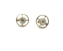 Diamond target stud earrings, central old cut diamond weighing an estimated 0.35cts each, set in a