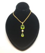 Peridot and pearl necklace, pear cut peridot claw set, suspended from a 5mm white pearl, a larger