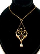 Art Nouveau Garnet and Pearl pendant and chain, stamped and tested as 9ct, approximately 3.1g gross