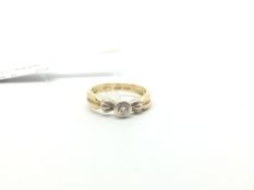 Single stone diamond ring, brilliant cut diamond rub over set, estimated diamond weight 0.15ct,