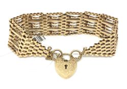 Vintage gate bracelet with heart padlock, chain is 26mm wide and Hallmarked for 9ct. Approximately