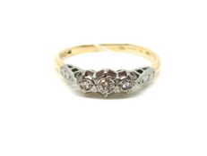 Three Stone Diamond Ring. Gold and platinum mount. Stamped 18ct Plat as well as later hallmark for