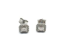 Contemporary emerald cut diamond cluster earrings, central emerald cut diamond surrounded by a