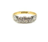 Three Stone Diamond Ring. Gold and platinum mount. Stamped 18ct Plat as well as later hallmark for