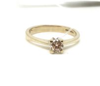 A solitaire diamond ring. Approximately 2.5g gross, ring size J. Fully hallmarked for 18ct gold.