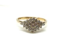 A diamond cluster ring. Ring size O, Approximately 2.1g gross. Fully hallmarked for 9ct gold. 0.50ct