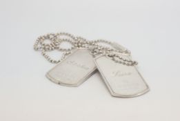 A pair of Gucci dog tags with chain, marked and tested as silver, approx gross weight 54gr