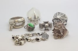 A selection of skull and other designed heavy banded rings, marked and tested as silver, gross