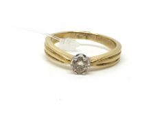 A solitaire diamond ring. Approximately 3.6g gross, ring size O. Stamped 375, tested as 9ct gold.