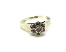 A diamond cluster ring. Ring size N, Approximately 2.8g gross. Fully hallmarked for 9ct gold. 0.08ct