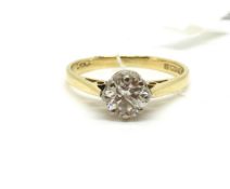 A solitaire diamond ring. Approximately 2.1g gross, ring size J. Fully hallmarked for 18ct gold.