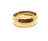 A 9ct gold wedding band. UK size P. 7mm wide, approximately 7.3g gross. Fully hallmarked for 9ct