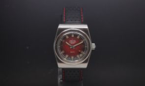 A Gentlemans Zenith Automatic Watch Defy 1970s. The dial is a rich red colour with silver edged