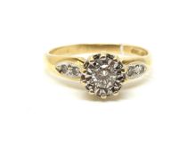 A solitaire diamond ring. Approximately 3.2g gross, ring size M. Diamond set shoulders. Fully