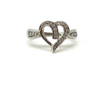 Heart shaped diamond set ring. Approximately 4.3g gross. Fully hallmarked for 9ct gold. Size M 1/2.