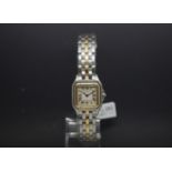 Ladies Mini Cartier two tone Steel and yellow metal bracelet and bezel, with square Roman dial,