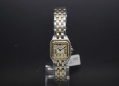 Ladies Mini Cartier two tone Steel and yellow metal bracelet and bezel, with square Roman dial,
