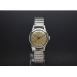 A Gentlemen's Military Longines stainless steel watch circa 1940s. Champagne coloured dial with