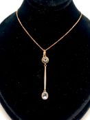 9ct drop pendant and chain, oval stone suspended from a bar and circular stone, in rose gold,