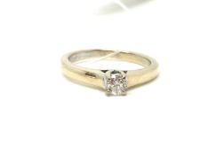 A solitaire diamond ring. Approximately 3.4g gross, ring size K. Fully hallmarked for 18ct gold.