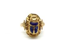 A scarab ring set with lapis lazuli. Ring size M, approximately 2.1g gross. Stamped and tested as