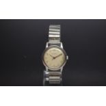 Gentlemen's Garrard stainless steel wrist watch. Circa 1960s A off white cream dial with Arabic