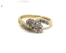 Diamond bypass ring. Fully hallmarked for 9ct gold. Approximately 2.2g gross. Ring size J. Estimated