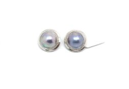 Pair of Tahitian Mabé pearl clip-on earrings, pearl measures approximately 14.5mm in diameter, set