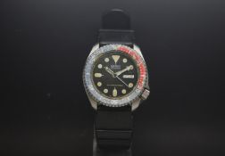 A Gentlemen's day and date Seiko 1970s diving watch. The watch has a classic aged luminous