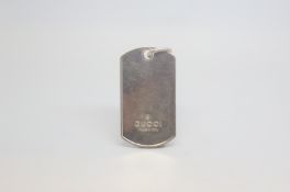 A single Gucci dog tag, marked and tested silver, approx gross weight 20.0gr