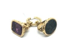 Two large antique fobs, one set with a blood stone seal, the other with a foil backed amethyst