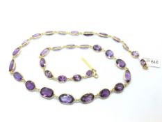 Chroussis amethyst necklace, thirty-three oval cut amethysts of varying size, each individually