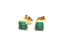 Single stone Columbian emerald ear studs, square step cut emeralds weighing an estimated 0.60ct