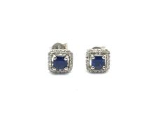 Contemporary princess cut sapphire and diamond cluster earrings, central square cut sapphire