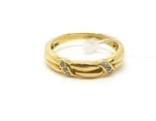 Diamond set band. Approximately 3.5g gross. Fully hallmarked for 18ct gold. Size N.