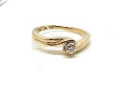 A solitaire diamond ring. Approximately 2.1g gross, ring size J 1/2. Fully hallmarked for 9ct