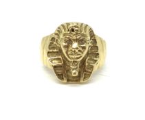 Tutankhamun Gold Ring. Stamped and tested as 18ct gold. Gem set eyes, approximately 9.8g gross. Size