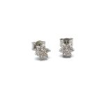 Contemporary diamond daisy cluster earrings, mounted in platinum, estimated colour G/H, clarity VS