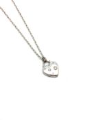 Tiffany & Co 18ct white gold heart pendant, set with five round brilliant cut diamonds, on a Tiffany