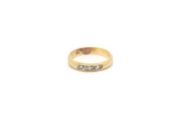 18ct gold stone three stone band. 6.06g Stamped and tested 18k.