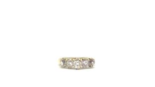 An antique old cut diamond ring. Set in yellow metal testing as gold. Total diamond weight